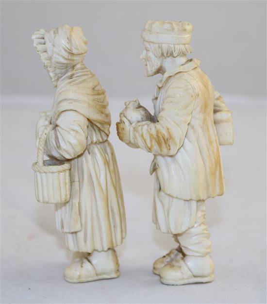 A pair of 19th century Dieppe ivory carvings of an elderly man and woman, 4.25in.